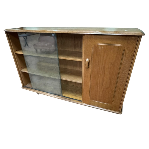 335 - Ercol style cabinet bookcase, 87cm by 136cm by 35cm.