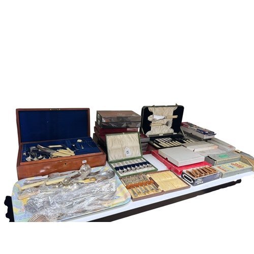 63 - Collection of flatware in boxes, cases and loose.