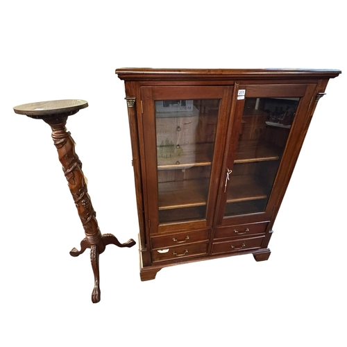 277 - Barker & Stonehouse cabinet bookcase having two glazed panel doors above four drawers, and carved tr... 