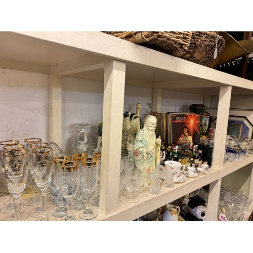 106 - Full shelf of china, glass, spirits and spirit measures, LP records, dinnerware, etc.