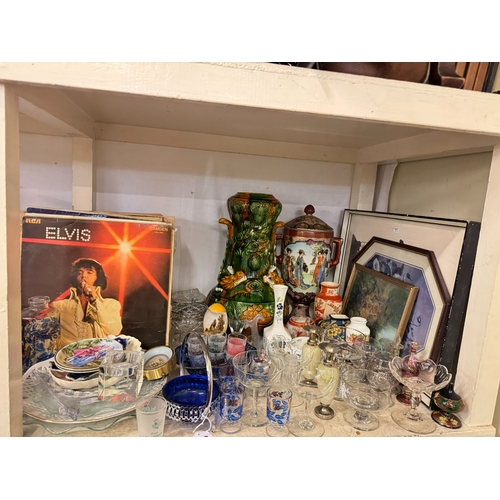 106 - Full shelf of china, glass, spirits and spirit measures, LP records, dinnerware, etc.
