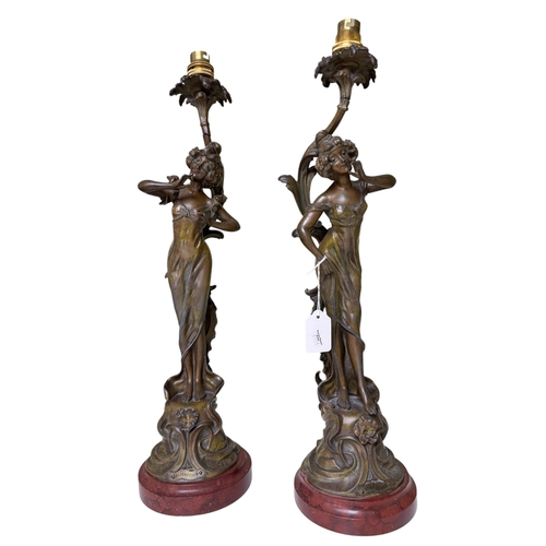 115 - Pair of spelter maiden figure lamps on marble stands, Confidence and Discretion.