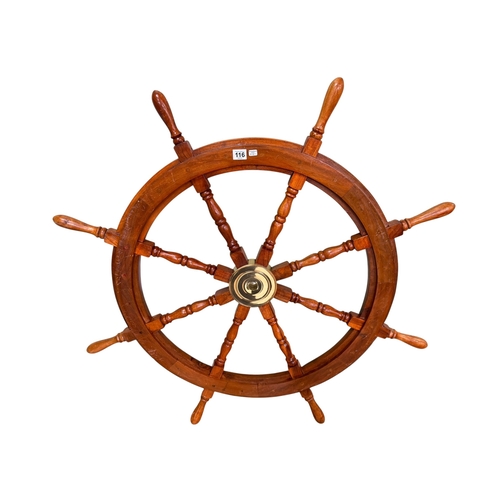 116 - Large mahogany and brass ships wheel.
