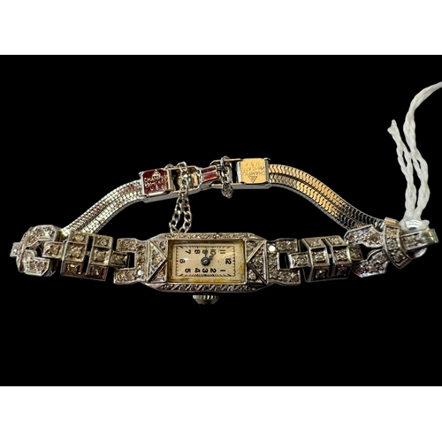 148 - 1920's platinum and diamond cocktail watch with sapphire mounted crown.