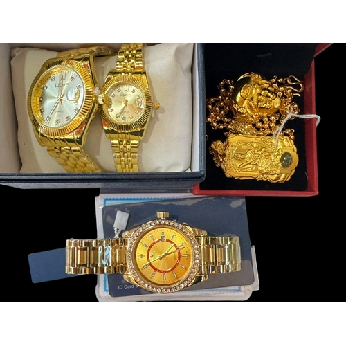 181 - Eidika gents watch, his and hers watches and two pendants with chains.