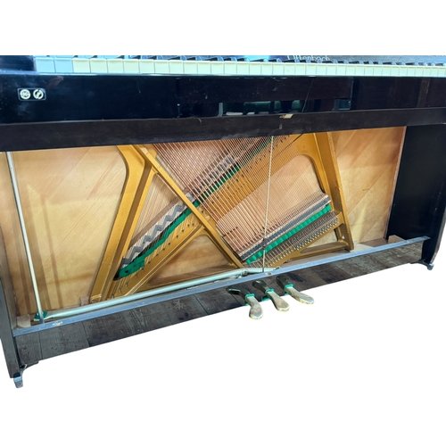 326 - Black lacquered Offenbach upright overstrung piano serial number 132909.