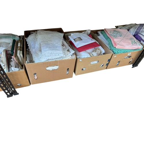 75 - Eleven boxes of assorted lace and linen eiderdowns, bed covers, etc.