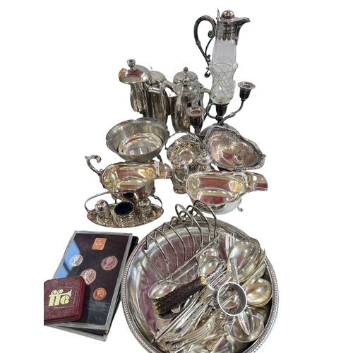 77 - Collection of silver plate including pair of sauce boats, claret jug and cutlery set.