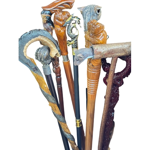 81 - Large collection of novelty walking sticks including many boxed as new.