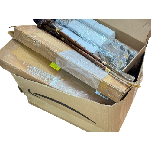 81 - Large collection of novelty walking sticks including many boxed as new.