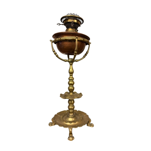 99 - Victorian brass and copper oil lamp, two pairs of brass candlesticks, Martingale, etc.