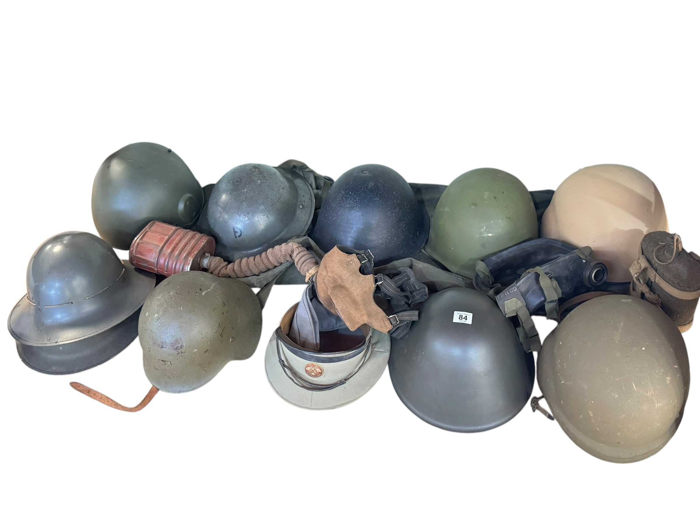 Collection of military memorabilia including helmets, gas masks, medals ...