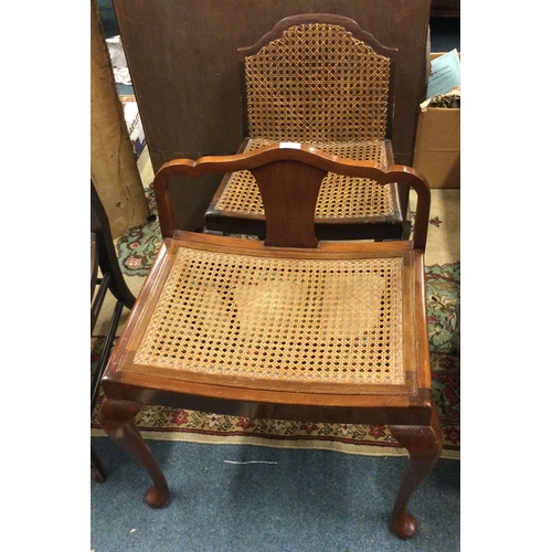 299 - A matched pair of cane chairs.