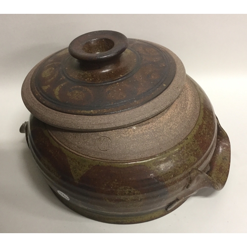 489 - MICK MORGAN (British b. c1950): A stoneware lidded soup tureen with chunky lug handles in muted oliv... 