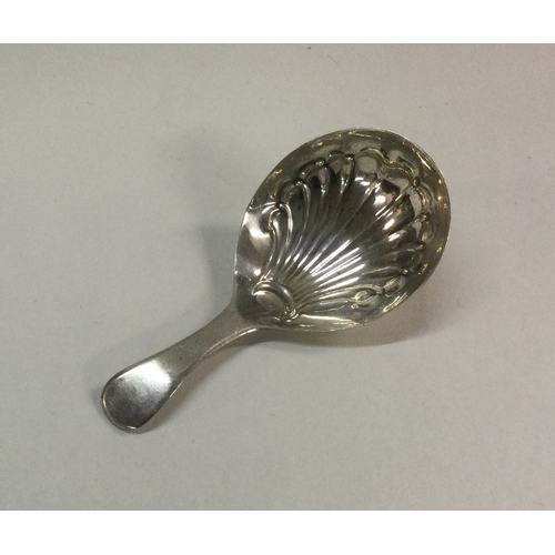 106 - A George III silver caddy spoon with fluted bowl. Sheffield. Approx. 9 grams. Est. £30 - £50.