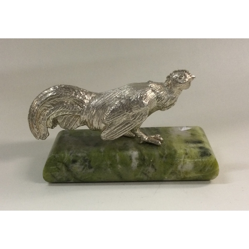 109 - A heavy silver figure of a bird on marble base. Approx. 390 grams to include base. Est. £250 - £350.