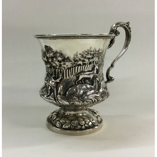 126 - A heavy William IV chased silver christening cup with animal decoration. London 1834. By Charles Gor... 