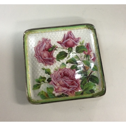 128 - A heavy silver and enamelled dish. Approx. 99 grams. Est. £100 - £150.