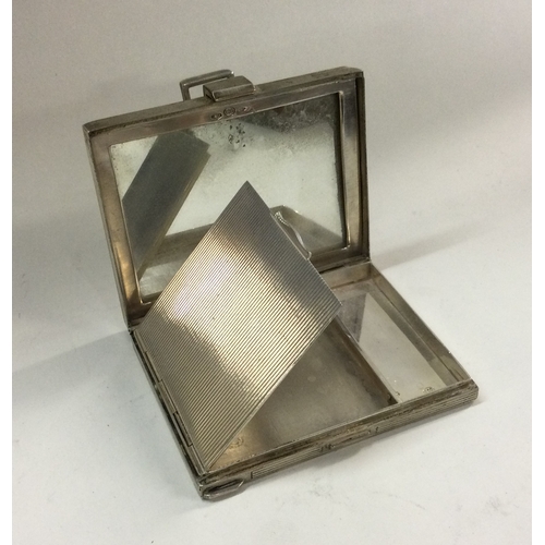 138 - A heavy textured silver compact. Approx. 154 grams. Est. £80 - £120.