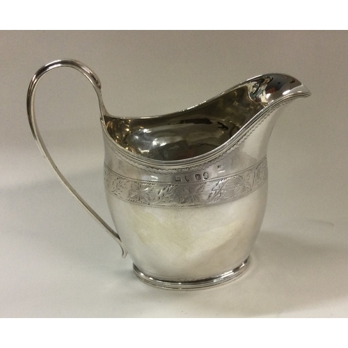 154 - A George III bright cut silver cream jug. London 1796. By Robert Hennell. Approx. 132 grams. Est. £7... 