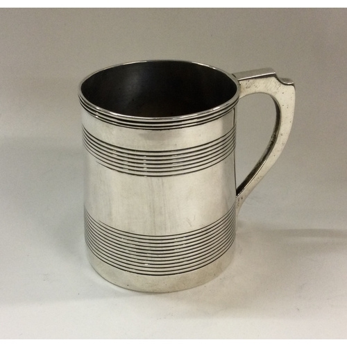 159 - A good George III reeded silver mug. London 1803. By TT. Approx. 93 grams. Est. £150 - £250.