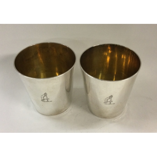 171 - A fine pair of stacking silver beakers inscribed with the family crest of 'Glendinning'. London 1801... 