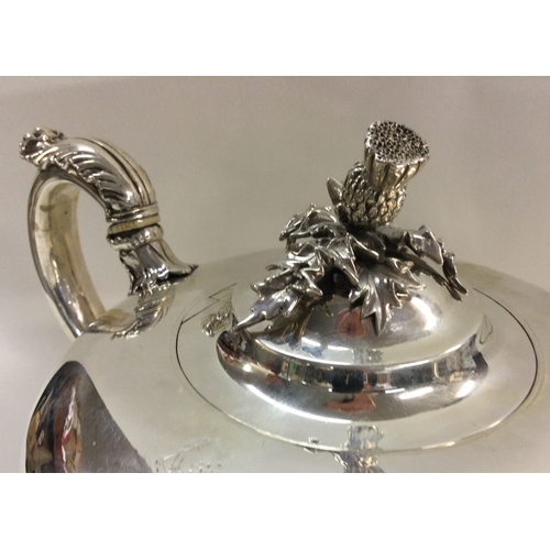 173 - An early Victorian silver teapot with chased acorn finial and acanthus capped scroll handle. London ... 