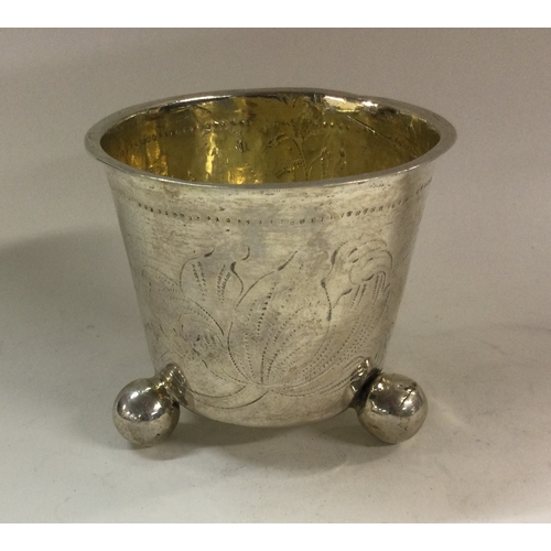 181 - An early 18th Century Norwegian silver beaker on feet. Circa 1750. Marked to base. Approx. 90 grams.... 