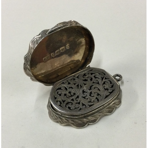 286 - An engraved silver vinaigrette. Birmingham 1879. By George Unite. Approx. 28 grams. Est. £200 - £300... 