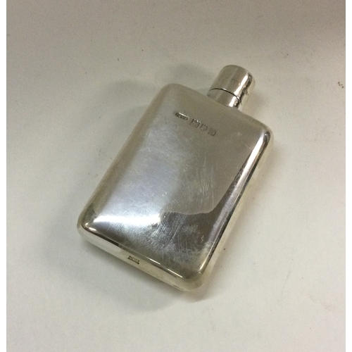 366 - A silver flask with screw-on lid. London 1909. By George Adams. Approx. 63 grams. Est. £120 - £150.