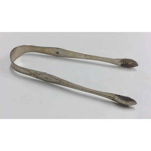 416 - PETER & ANN BATEMAN: A good pair of bright cut silver sugar tongs. Approx. 30 grams. Est. £20 - £30.