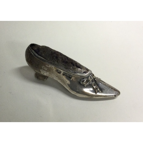 431 - A novelty silver pin cushion in the form of a shoe. Birmingham. By AS. Approx. 16 grams. Est. £50 - ... 