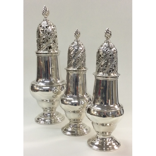 44 - A rare set of three good George III silver sugar casters. London 1763. By John Delmester. Approx. 48... 