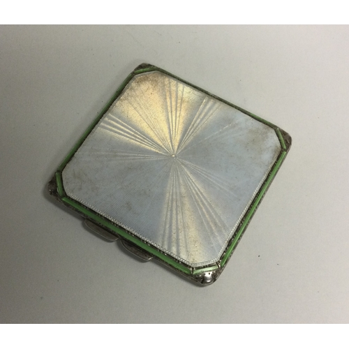 452 - A silver and enamelled compact. Birmingham. By A Bros. Approx. 81 grams. Est. £50 - £80.