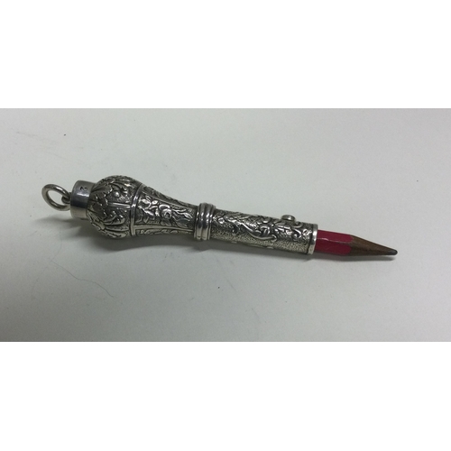 456 - A heavy Continental silver extending pencil with chased decoration. Approx. 46 grams. Est. £50 - £80... 