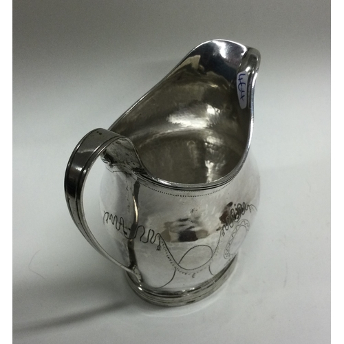 464 - A good Georgian silver bright cut cream jug on reeded base. London. Approx. 113 grams. Est. £60 - £8... 