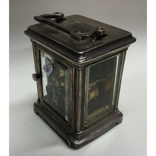 467 - An Edwardian silver carriage clock with white enamelled dial to bracket feet. Birmingham. By Elkingt... 