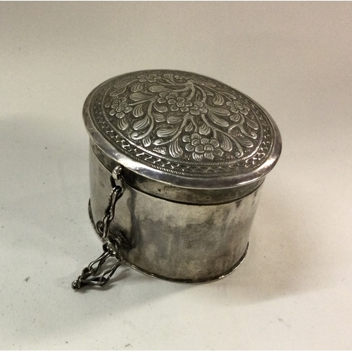 484 - A Chinese silver pill box and cover decorated with flowers and leaves. Approx. 42 grams. Est. £20 - ... 