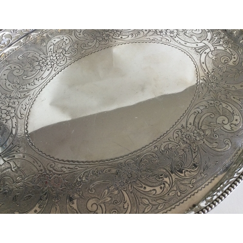 502 - An Edwardian silver circular gallery tray with pierced border. London. Approx. 693 grams. Est. £500 ... 