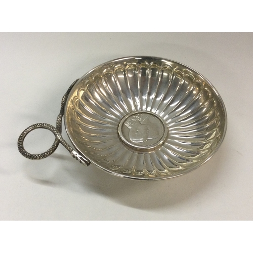 51 - A 19th Century silver wine taster with coin centre. Approx. 67 grams. Est. £60 - £80.