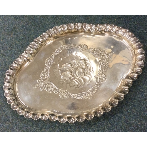 52 - A heavy silver dressing table tray attractively decorated with cherubs. Birmingham 1901. By Henry Ma... 