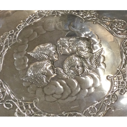 52 - A heavy silver dressing table tray attractively decorated with cherubs. Birmingham 1901. By Henry Ma... 