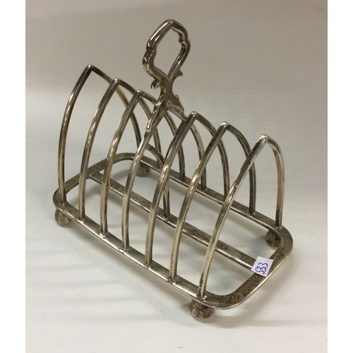 533 - A heavy Victorian silver toast rack. Birmingham. By Samuel Walton Smith. Approx. 228 grams. Est. £14... 