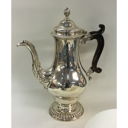 68 - An early George III silver baluster shaped coffee pot. London 1762. By William Grundy. Approx. 915 g... 