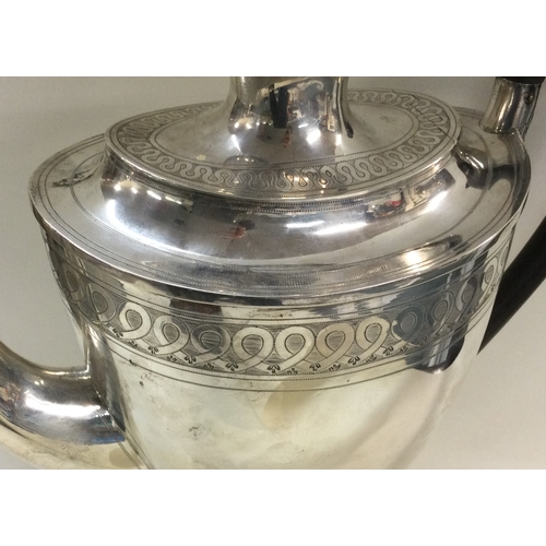 70 - A large George III baluster shaped silver coffee pot with engraved lid and body. London 1799. By Jam... 