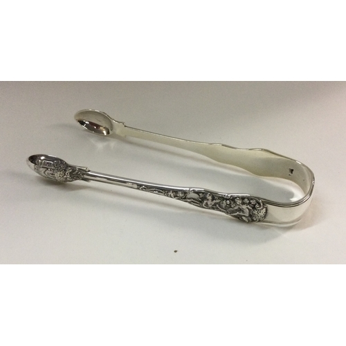 78 - A heavy pair of cast silver sugar tongs. London. Approx. 76 grams. Est. £40 - £60.