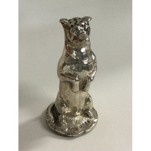 99 - An unusual silver pepper in the form of a dog in standing position. London 1874. By Henry Curry. App... 