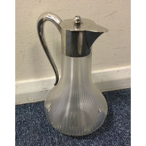 491 - An Austrian silver lemonade jug with hinged top and textured body. Est. £250 - £300.