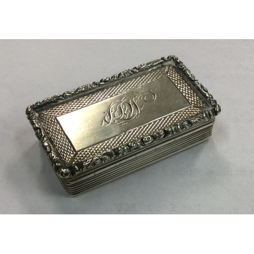 74 - A large William IV silver snuff box with chased decoration. Birmingham 1835. By Francis Clark. Appro... 