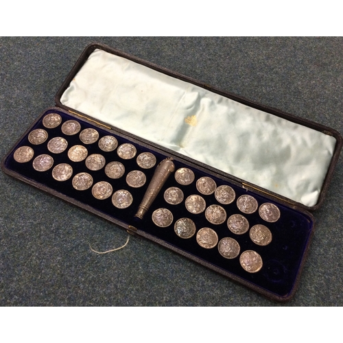 95 - A good cased set of 33 silver buttons together with matching cane handle. Retailed by Skinners of Lo... 